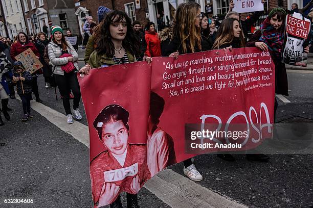 Women hold placards during a protest held in solidarity with the Washington DC Women's March in Dublin, Ireland on January 21, 2017.