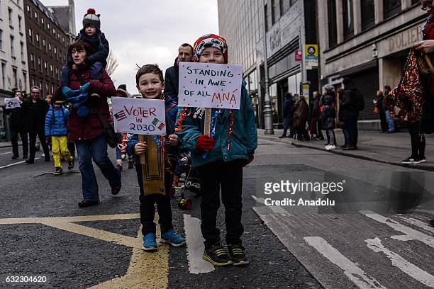 Children hold placards during a protest held in solidarity with the Washington DC Women's March in Dublin, Ireland on January 21, 2017.
