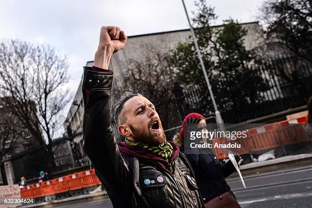 People shout slogans during a protest held in solidarity with the Washington DC Women's March in Dublin, Ireland on January 21, 2017.