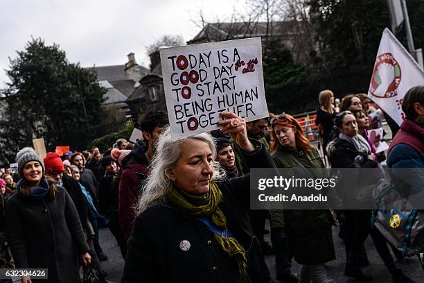 Women hold placards during a protest held in solidarity with the Washington DC Women's March in Dublin, Ireland on January 21, 2017.