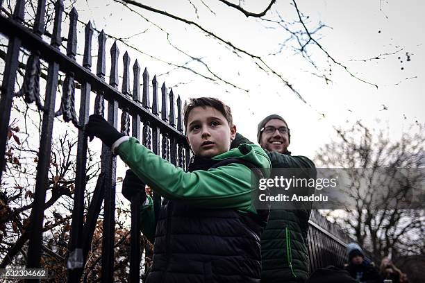 Two men attend a protest held in solidarity with the Washington DC Women's March in Dublin, Ireland on January 21, 2017.