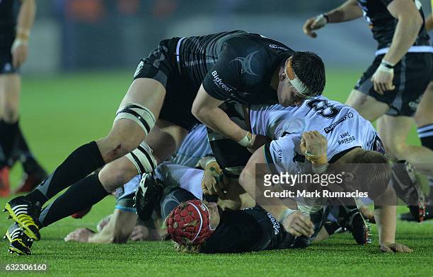 Mouritz Botha of Newcastle Falcons is tackled by Olly Cracknell of Ospreys Rugby during the European Rugby Challenge Cup pool 2 match between...