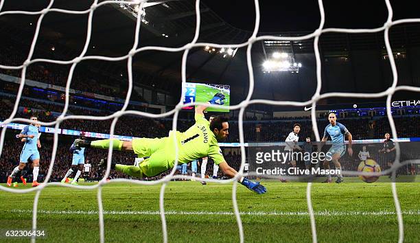 Heung-Min Son of Tottenham Hotspur scores his sides second goal past Claudio Bravo of Manchester City during the Premier League match between...