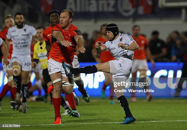 Matt Giteau of RC Toulon is charged down by Schalk Burger of Saracens during the European Rugby Champions Cup between Saracens and RC Toulon at...