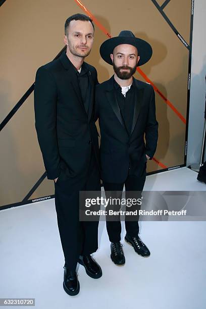 Stylist Kris Van Assche and Woodkid pose backstage after the Dior Homme Menswear Fall/Winter 2017-2018 show as part of Paris Fashion Week on January...