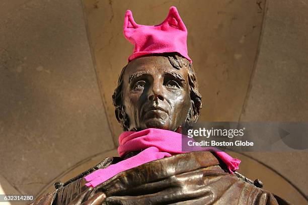 Thousands of people filled Boston Common for the Boston Women's March for America, Saturday, Jan. 21, 2017. Someone adorned the statue of William...