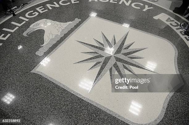 The logo of the CIA is seen during a visit ofUS President Donald Trump the CIA headquarters on January 21, 2017 in Langley, Virginia . Trump spoke...