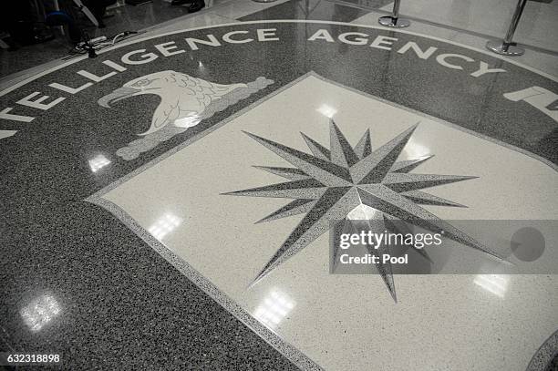 The logo of the CIA is seen during a visit ofUS President Donald Trump the CIA headquarters on January 21, 2017 in Langley, Virginia . Trump spoke...