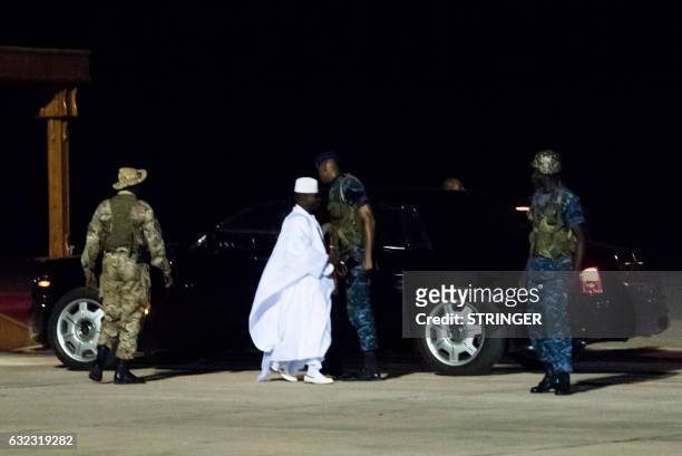 Former president Yaya Jammeh , the Gambia's leader for 22 years, walks towards the plane as he leaves the country on 21 January 2017 in Banjul...
