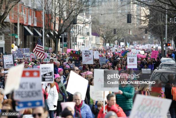 An estimated 120,000 people participate in the Women's March in Seattle, Washington, on January 21, 2017. - Led by women in pink "pussyhats,"...