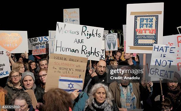 Demonstrators hold banners and shout slogans during the protest in support of 'Women's March' parade against President Donald Trump at Washington,...