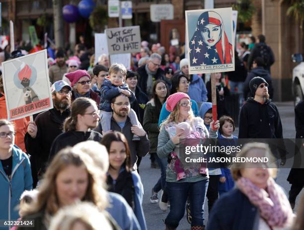 An estimated 120,000 people participate in the Women's March in Seattle, Washington on January 21, 2017. - Led by women in pink "pussyhats," hundreds...