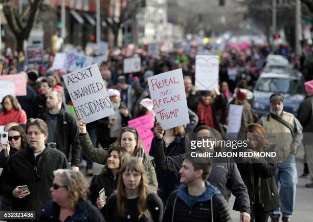 An estimated 120,000 people participate in the Women's March in Seattle, Washington on January 21, 2017. - Led by women in pink "pussyhats," hundreds...
