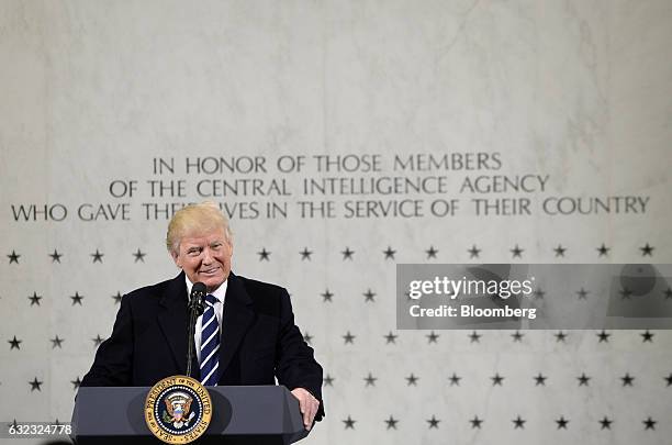 President Donald Trump smiles while speaking at the CIA Headquarters in Langley, Virginia, U.S., on Saturday, Jan. 21, 2017. Trump assured employees...