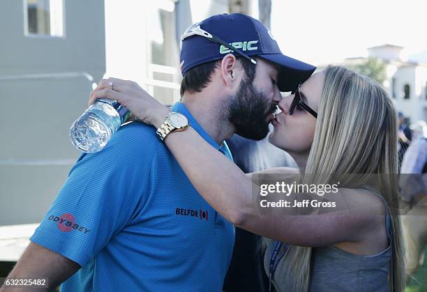 Adam Hadwin of Canada kisses his fiance Jessica Kippenberger after shooting a 59 during the third round of the CareerBuilder Challenge in Partnership...