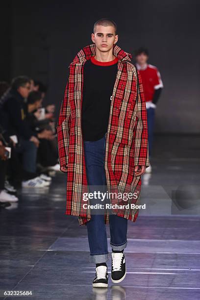 Model walks the runway during the Ami Alexandre Mattiussi Menswear Fall/Winter 2017-2018 show as part of Paris Fashion Week on January 21, 2017 in...