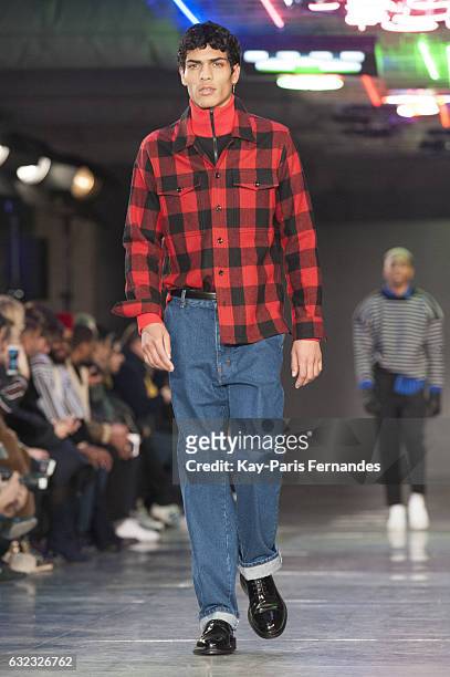 Model walks the runway during the Ami Alexandre Mattiussi Menswear Fall/Winter 2017-2018 show as part of Paris Fashion Week on January 21, 2017 in...