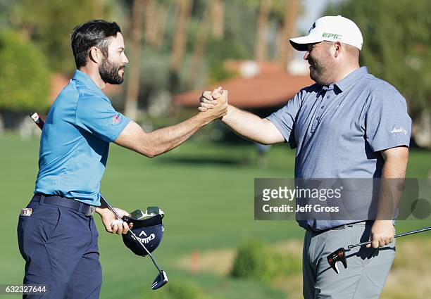 Adam Hadwin of Canada shakes hands with Colt Knost on the 18th hole during the third round of the CareerBuilder Challenge in Partnership with The...