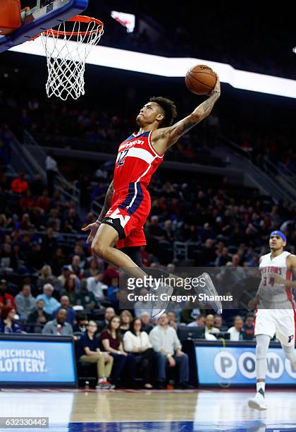Kelly Oubre Jr. #12 of the Washington Wizards gets in for a first half dunk while playing the Detroit Pistons at the Palace of Auburn Hills on...