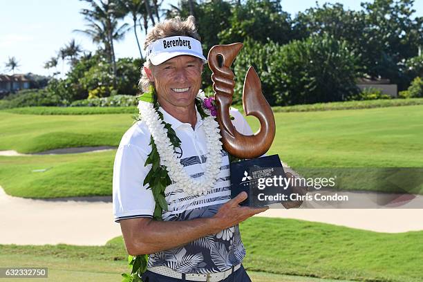 Bernhard Langer of Germany poses with the tournament trophy after winning the weather-shortened PGA TOUR Champions Mitsubishi Electric Championship...