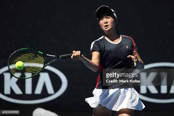 Anri Nagata of Japan plays a shot against Alexandra Bozovic of Australia during the Australian Open 2017 Junior Championships at Melbourne Park on...