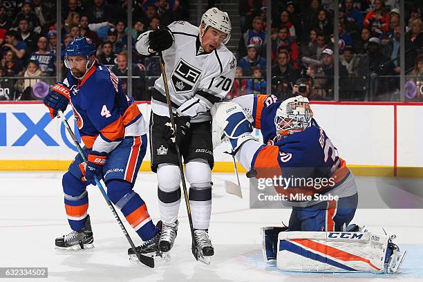 Jean-Francois Berube of the New York Islanders makes a save Dennis Seidenberg and Tanner Pearson of the Los Angeles Kings looks on at the Barclays...