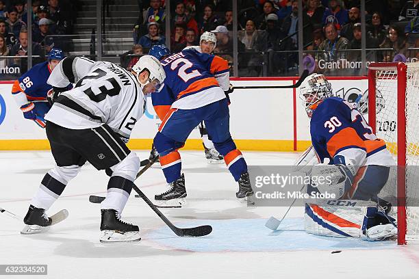 Jean-Francois Berube of the New York Islanders makes a save against Dustin Brown of the Los Angeles Kings at the Barclays Center on January 21, 2017...