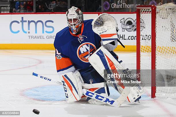 Jean-Francois Berube of the New York Islanders keeps his eyes on the puck against the Los Angeles Kings at the Barclays Center on January 21, 2017 in...