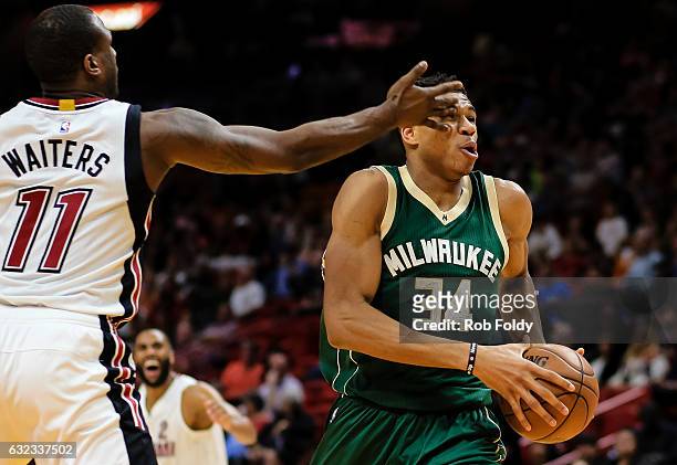 Giannis Antetokounmpo of the Milwaukee Bucks is hit in the eye by Dion Waiters of the Miami Heat during the first half of the game at American...