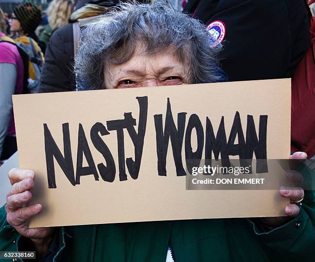 Protesters gather in midtown Manhattan as part of the Women's march vowing to resist US President Trump January 21, 2017 in New York. Hundreds of...