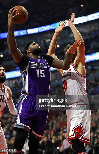 DeMarcus Cousins of the Sacramento Kings puts up a shot against Robin Lopez of the Chicago Bulls at the United Center on January 21, 2017 in Chicago,...