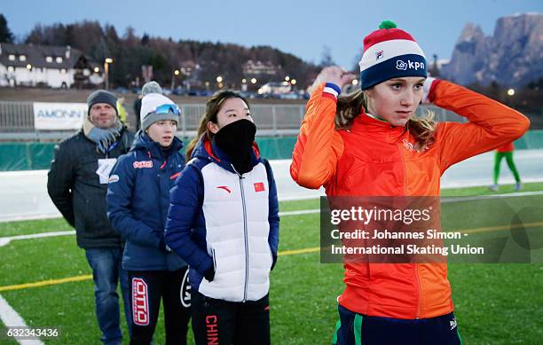 Karolina Bosiek of Poland, Mei Han of China and Sanne in 't Hof of the Netherlands arrive for the medal ceremony after winning the women's junior...