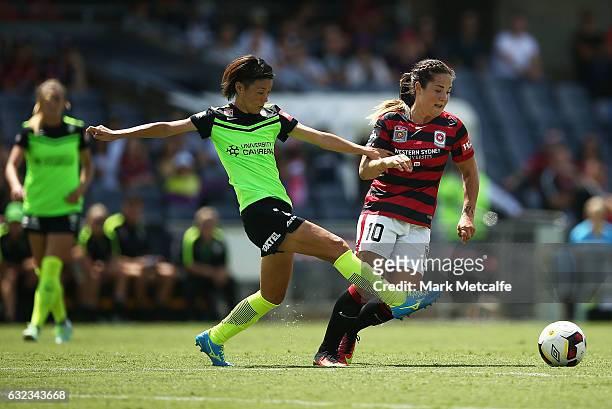 Paige Nielsen of the Wanderers is challenged by Yukari Kinga of Canberra during the round 13 W-League match between the Western Sydney Wanderers and...