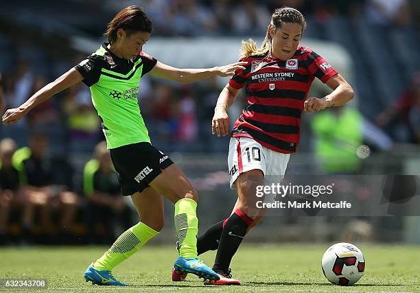 Paige Nielsen of the Wanderers is challenged by Yukari Kinga of Canberra during the round 13 W-League match between the Western Sydney Wanderers and...