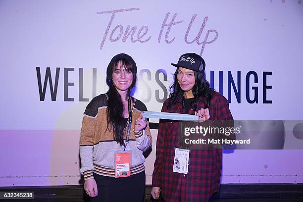 Michell Latimer and Sarain Carson-Fox pose for a photo in the Tone It Up Wellness Loung during the Sundance Film Festival on January 21, 2017 in Park...