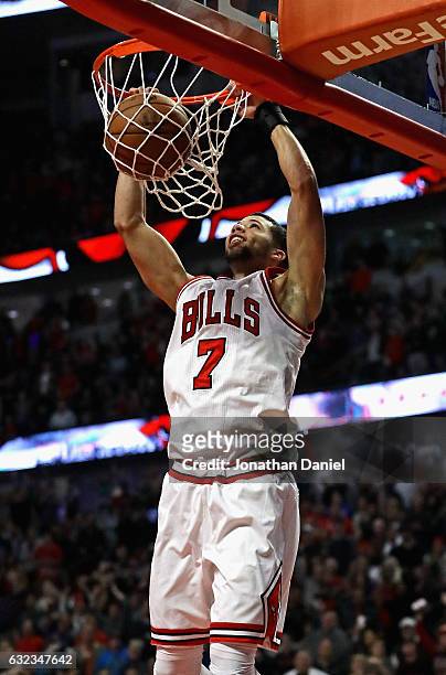 Michael Carter-Williams of the Chicago Bulls dunks the game-winning shot against the Sacramento Kings at the United Center on January 21, 2017 in...