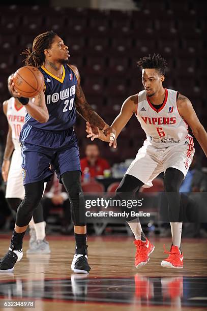 Cartier Martin of the Iowa Energy looks to pass the ball away from JP Tokoto of the Rio Grande Valley Vipers as part of 2017 NBA D-League Showcase at...