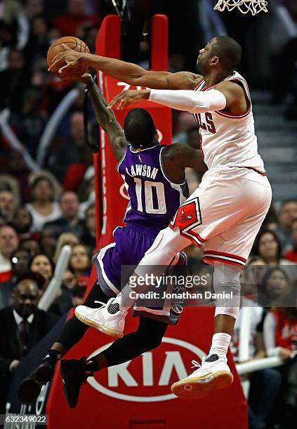 Dwyane Wade of the Chicago Bulls blocks a shot by Ty Lawson of the Sacramento Kings at the United Center on January 21, 2017 in Chicago, Illinois....