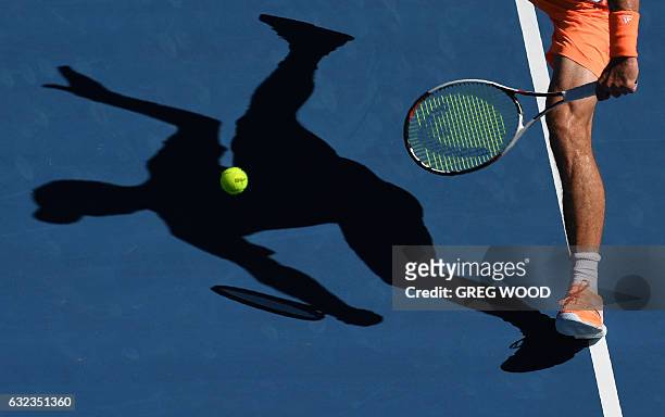 Germany's Mischa Zverev hits a return against Britain's Andy Murray during their men's singles fourth round match on day seven of the Australian Open...