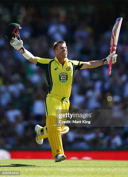 David Warner of Australia celebrates scoring a century during game four of the One Day International series between Australia and Pakistan at Sydney...