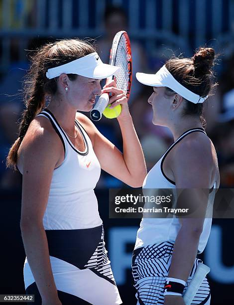 Aleksa Cveticanin and Seone Mendez of Australia compete in their first round match against Bianca Vanessa Andreescu of Canada and Carson Branstine of...