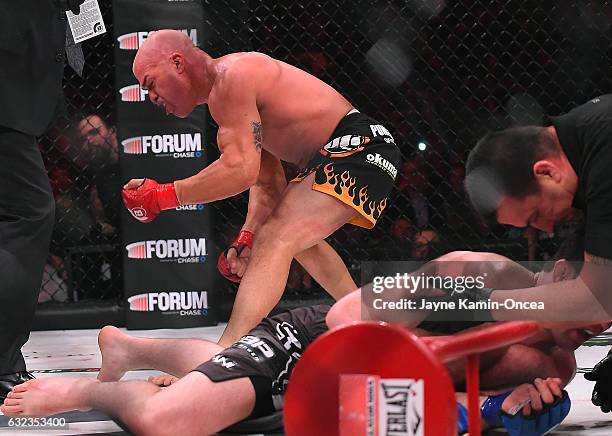 Tito Ortiz reacts as referee John McCarthy checks on Chael Sonnen after stopping their Bellator MMA light heavyweight fight in round one of at The...