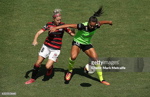 Erica Halloway of the Wanderers and Emma Checker of Canberra compete for the ball during the round 13 W-League match between the Western Sydney...