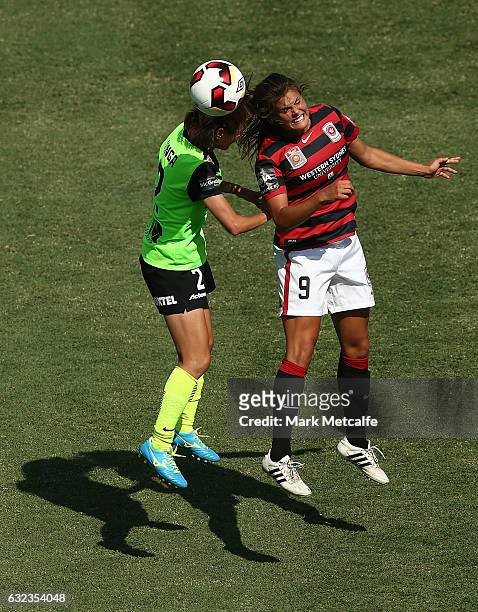 Katie Stengel of the Wanderers and Yukari Kinga of Canberra compete for a header during the round 13 W-League match between the Western Sydney...