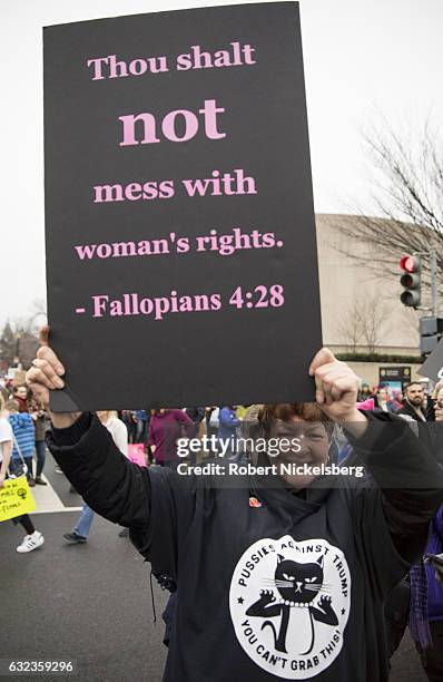 Marcher attending the Women's March on Washington holds up a pro-women's rights sign on January 21, 2017 in Washington, DC. President Trump was sworn...