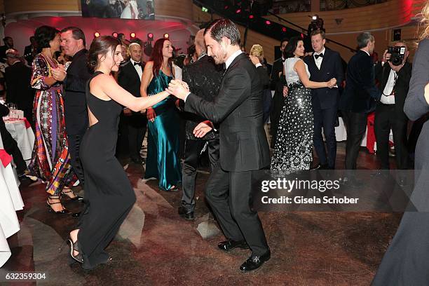 Aylin Tezel and Clemens Schick dance during the 44th German Film Ball 2017 party at Hotel Bayerischer Hof on January 21, 2017 in Munich, Germany.