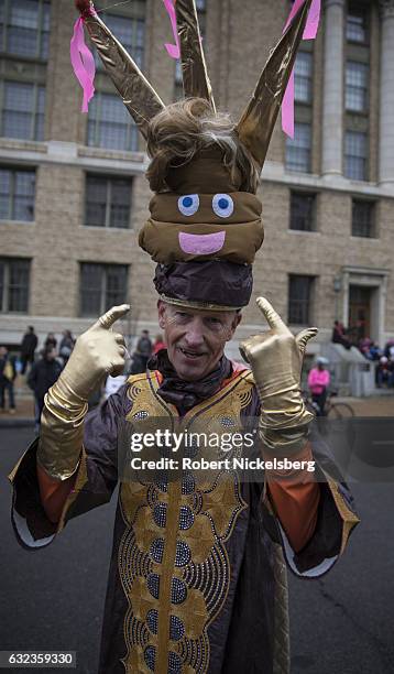 Marcher attending the Women's March on Washington wears a President Donald Trump head creation on January 21, 2017 in Washington, DC. President Trump...