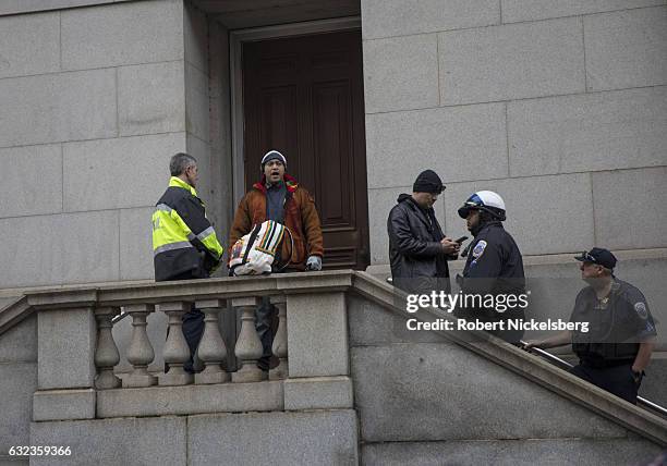 Protester is questioned by local policemen during the Women's March on Washington on January 21, 2017 in Washington, DC. President Donald J. Trump...