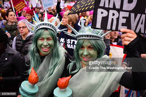 Sisters, Kristina Buchwald, left of Idaho Springs, Colorado and Laura Ast, of San Francisco, CA were dressed as the statue of liberty. Thousands of...