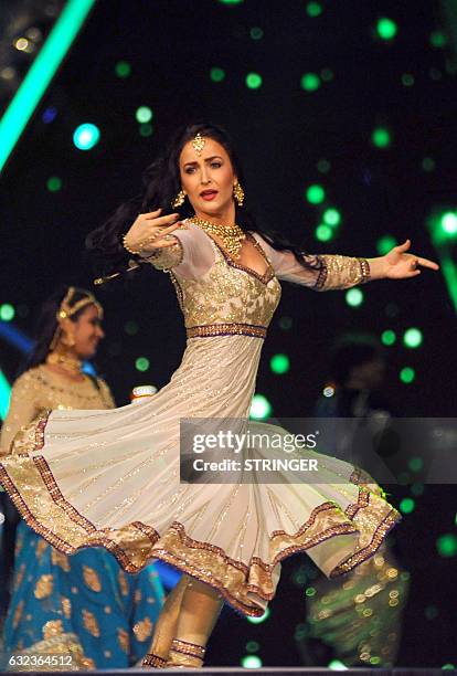 Indian Bollywood actress Elli Avram performs at the 'Umang Mumbai Police Show 2017 in Mumbai on January 21, 2017. / AFP / STRINGER